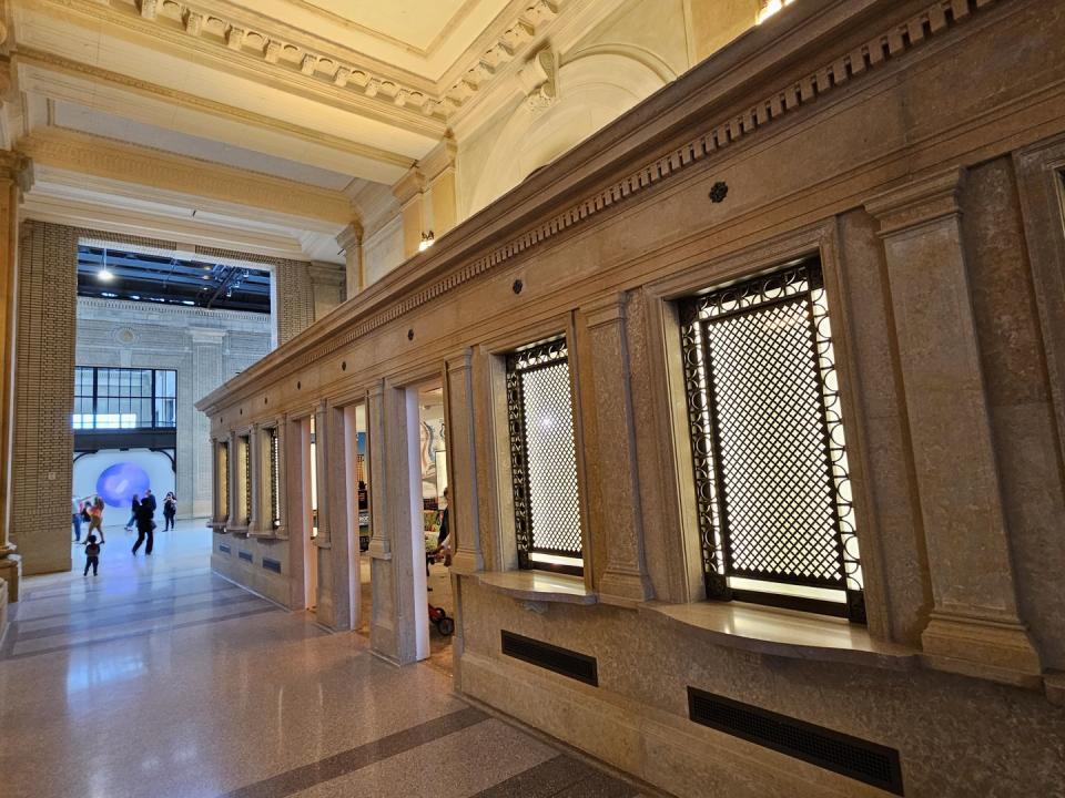 a large room with a large wooden floor and a large window