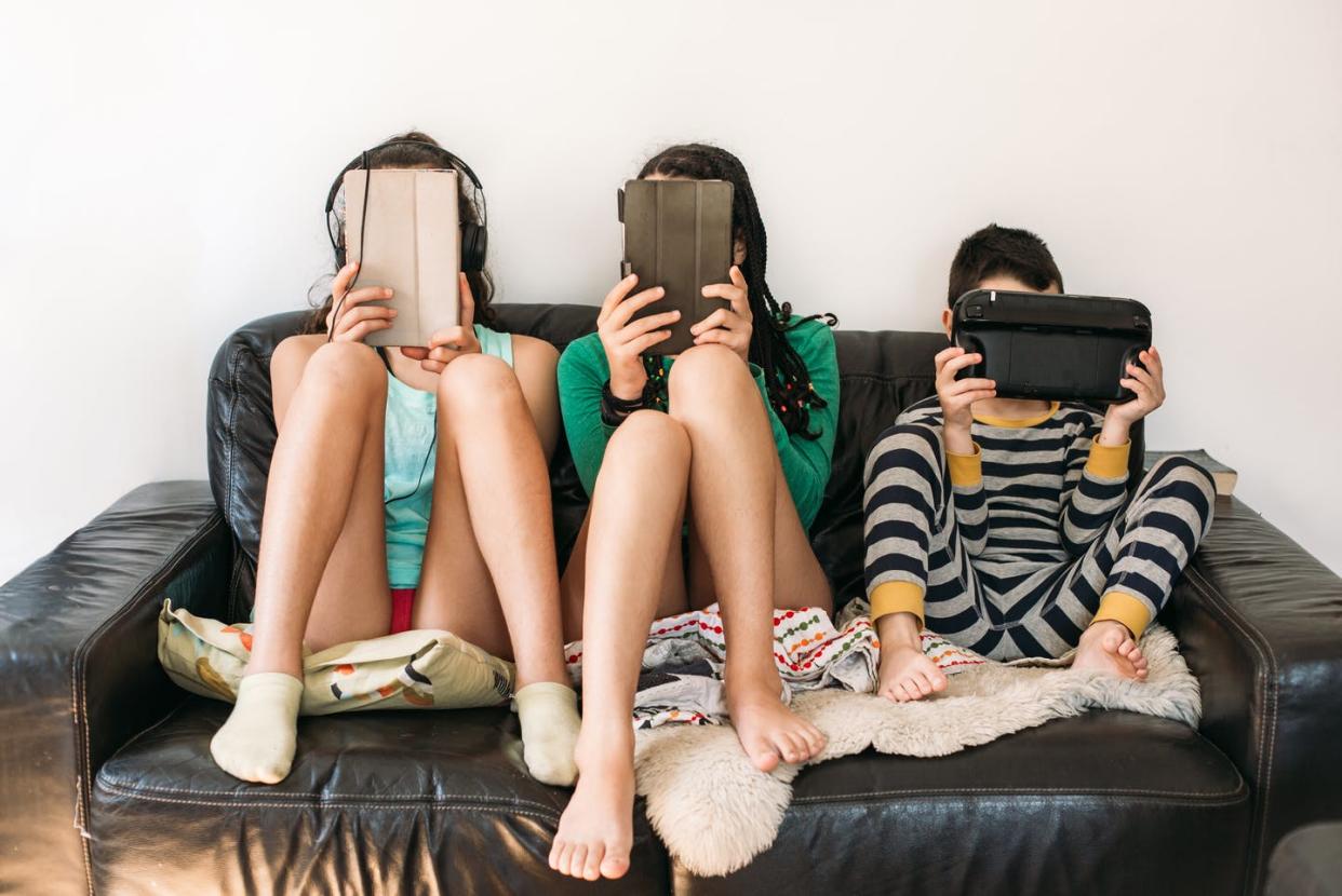 <span class="caption">Kids can be taught to read the web critically.</span> <span class="attribution"><a class="link " href="https://www.gettyimages.com/detail/photo/three-kids-with-electronic-devices-on-a-sofa-royalty-free-image/1243204343?adppopup=true" rel="nofollow noopener" target="_blank" data-ylk="slk:Os Tartarouchos/Moment/Getty Images;elm:context_link;itc:0;sec:content-canvas"> Os Tartarouchos/Moment/Getty Images</a></span>