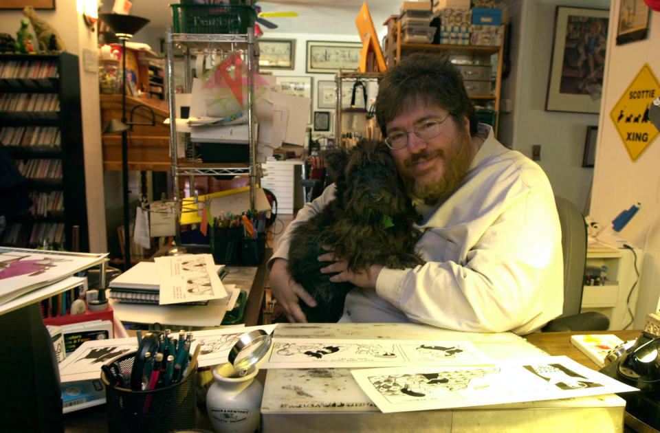 Sarasota cartoonist Chris Browne at his drawing table with his Scottish terrier,  MacDuff.  Browne spent nearly 30 years drawing Hagar the Horrible and created his own cartoon Raising Duncan, which was based loosely on the life of his dog.