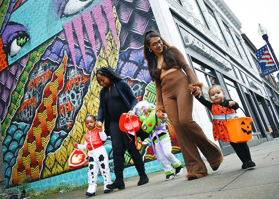 Trick-or-treaters enjoy Fall River's first Downtown Spooky Stroll on Monday, Oct. 31, 2022.