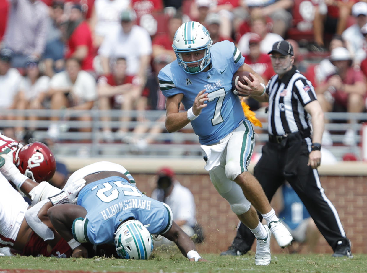 Tulane quarterback Michael Pratt (7) runs against Oklahoma during a NCAA college football game Saturday, Sept. 4, 2021, in Norman, Okla. (AP Photo/Alonzo Adams)