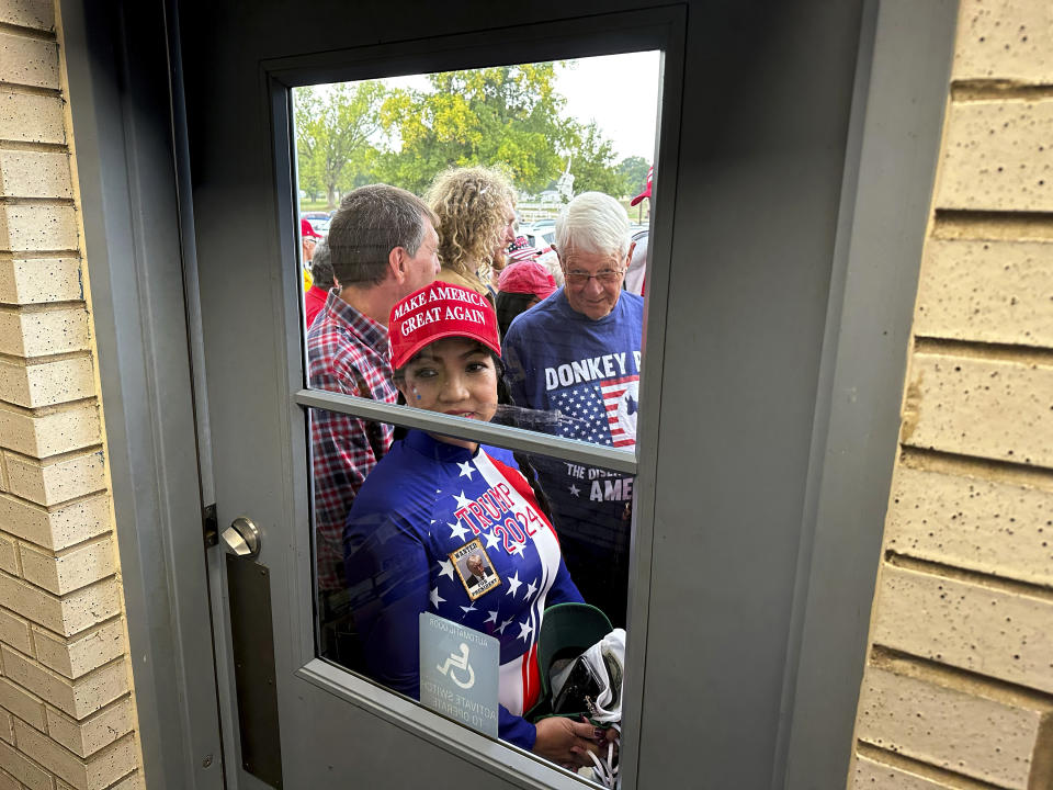 Supporters wait to enter a commit to caucus rally for former President Donald Trump, Wednesday, Sept. 20, 2023, in Maquoketa, Iowa. (AP Photo/Charlie Neibergall)