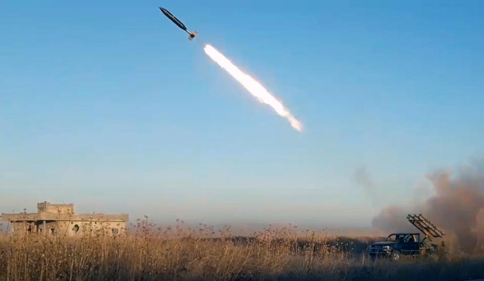 This photo provided by the Ibaa News Agency, the media arm of al-Qaida-linked Hayat Tahrir al-Sham militant group in Syria, purports to show a missile fired by the militant group against Syrian government forces position in Idlib province, Syria, Tuesday, Aug. 27, 2019. Ibaa said Hayat Tahrir al-Sham militant group fighters are attacking Syrian positions east of Khan Sheikhoun, a major town that was held by rebels until they lost it last week. (Ibaa News Agency via AP)