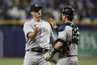 New York Yankees relief pitcher Clay Holmes, left, celebrates with catcher Kyle Higashioka after the team's win over the Tampa Bay Rays in a baseball game Friday, May 27, 2022, in St. Petersburg, Fla. (AP Photo/Scott Audette)