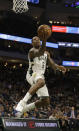 Milwaukee Bucks' Eric Bledsoe shoots against the Washington Wizards during the second half of an NBA basketball game Tuesday, Jan. 28. 2020, in Milwaukee. (AP Photo/Jeffrey Phelps)