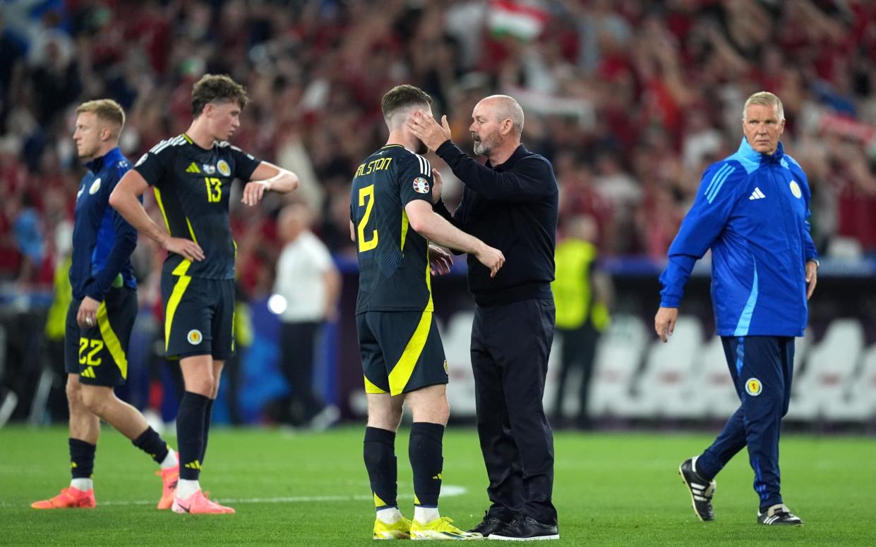 Scotland's Anthony Ralston and manager Steve Clarke react after exiting the tournament following the UEFA Euro 2024