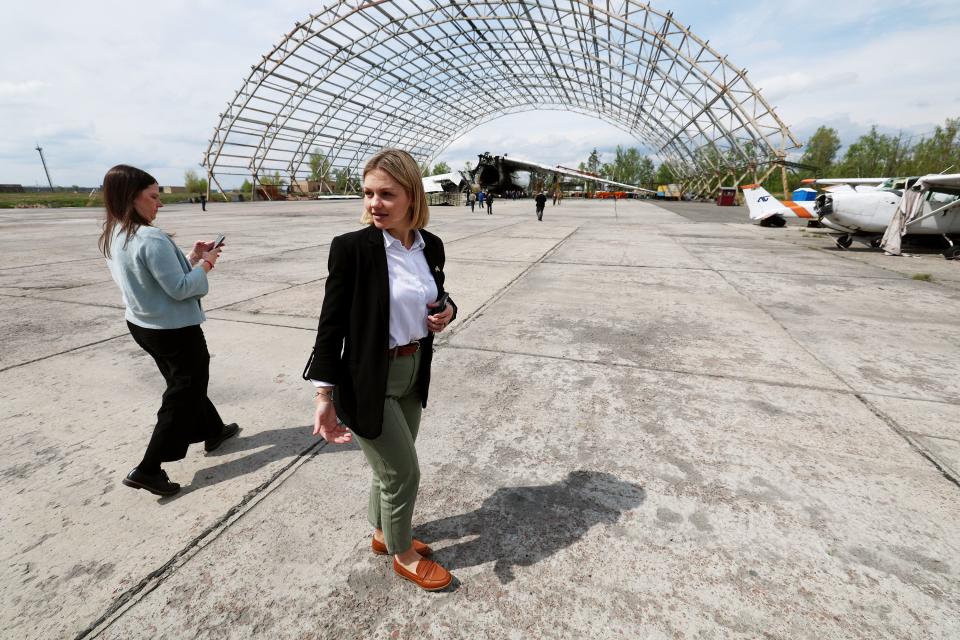 Viktoriia Tarasiuk, country manager for Ukraine and director of the August Mission Foundation of Ukraine, talks with UTah delegation members while visiting the debris of the Antonov AN-225 at Hostomel Airport on Monday, May 4, 2023. The plane was destroyed by Russian strikes outside of Kyiv, Ukraine. | Scott G Winterton, Deseret News