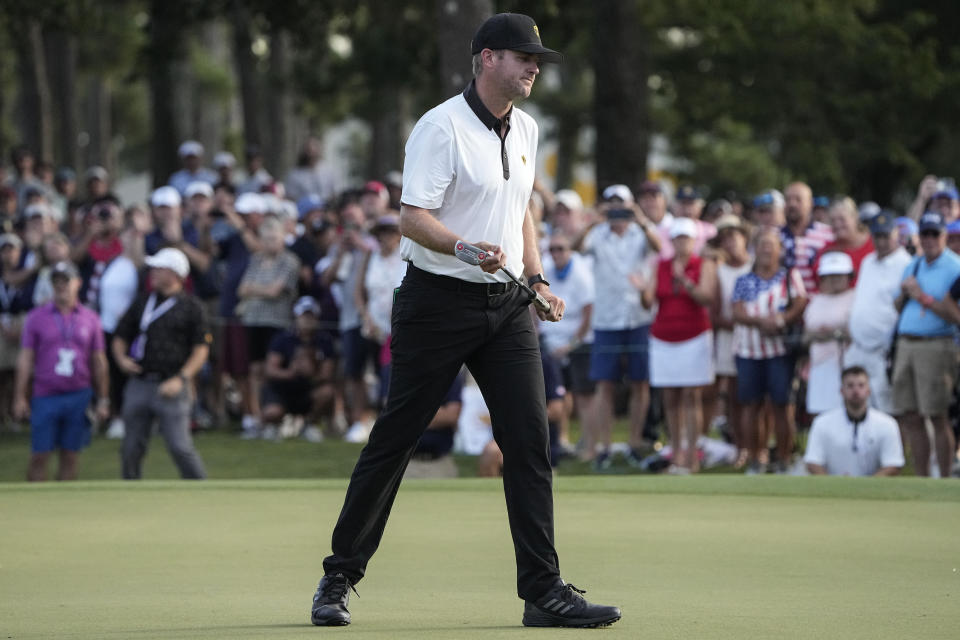 Taylor Pendrith, of Canada, misses his putt on the 18th green during their foursomes match at the Presidents Cup golf tournament at the Quail Hollow Club, Thursday, Sept. 22, 2022, in Charlotte, N.C. (AP Photo/Chris Carlson)