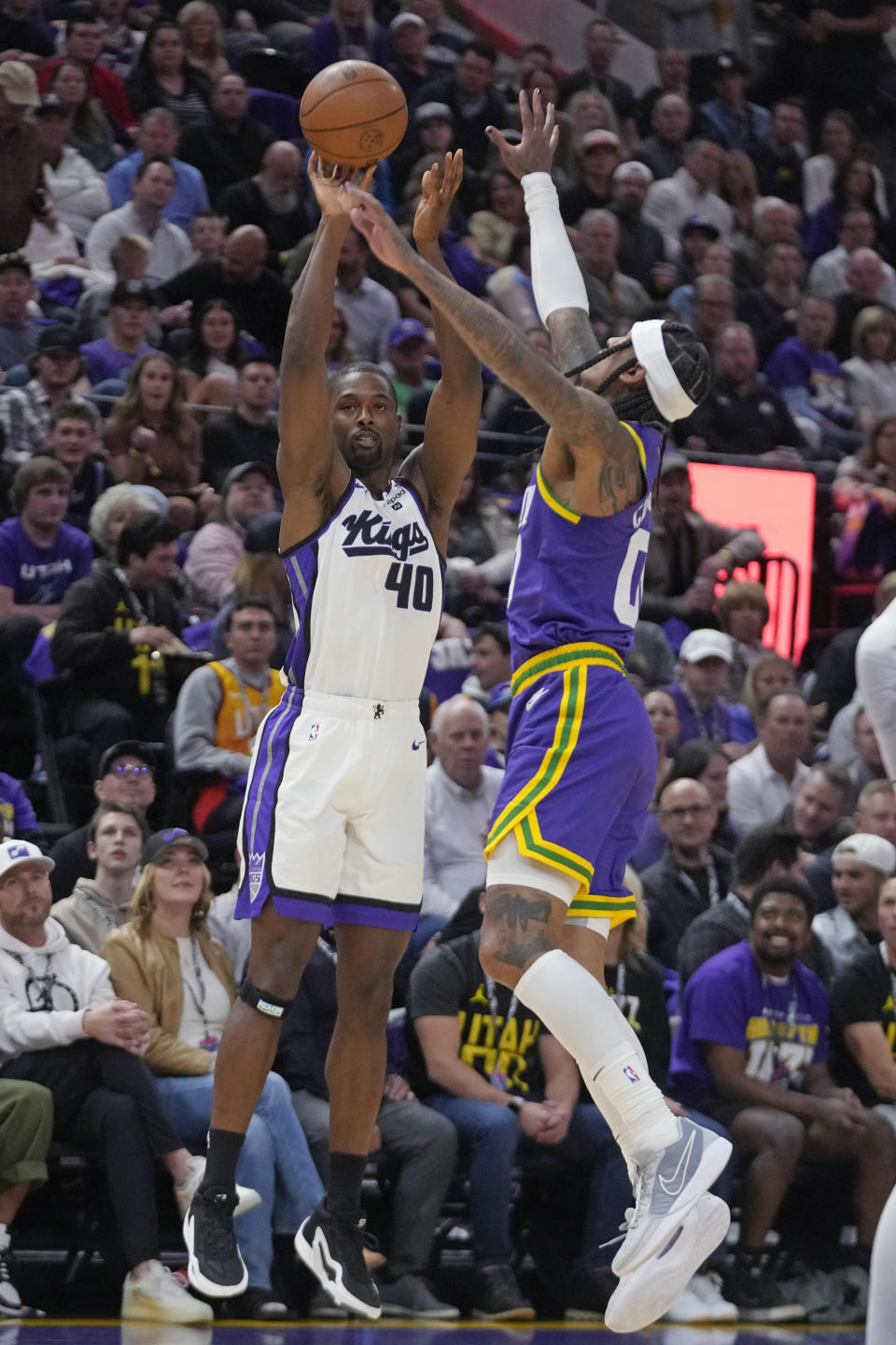 Sacramento Kings forward Harrison Barnes shoots as Utah Jazz guard Jordan Clarkson (00) defends during the first half of an NBA basketball game Wednesday, Oct. 25, 2023, in Salt Lake City. (AP Photo/Rick Bowmer)