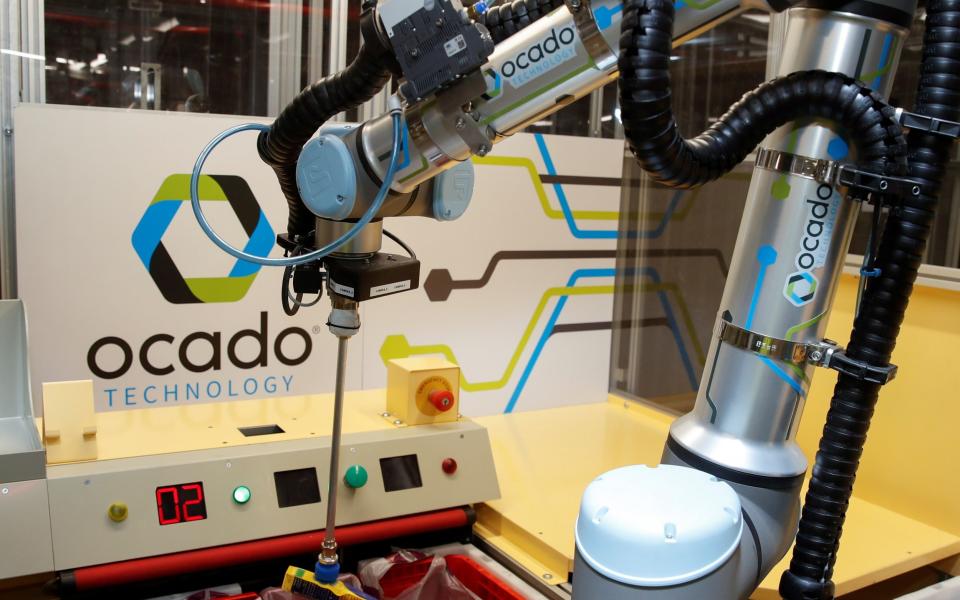 A robotic picking machine inside an Ocado warehouse in London, 2021