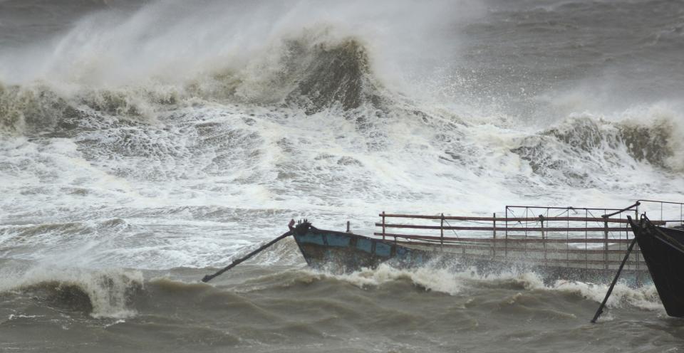 Waves caused by Typhoon Usagi rock boats anchored at a port in Quanzhou