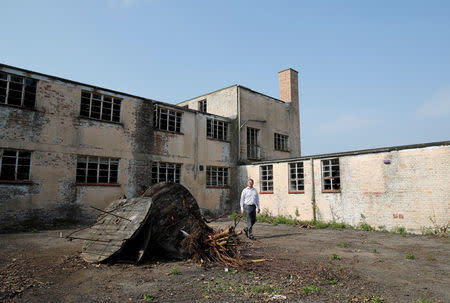 Chairman and founder of Bletchley Park Capital Partners Ltd Tim Reynolds looks around G-block where the National College of Cyber Education will be based at Bletchley Park in Milton Keynes, Britain, September 15, 2016. Picture taken September 15, 2016. REUTERS/Darren Staples