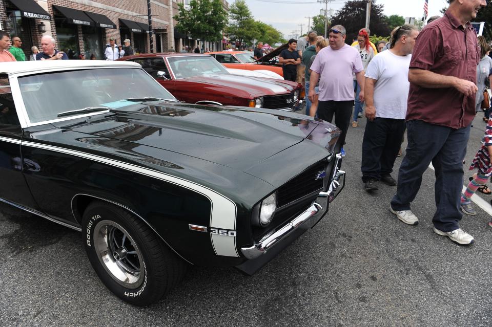 Classic cars line the street at the 25th annual Father's Day Car Show in Hyannis in 2019.