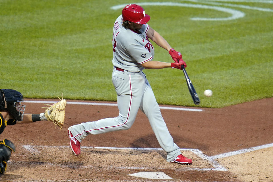 Philadelphia Phillies pitcher Aaron Nola hits an RBI sacrifice fly off Pittsburgh Pirates starting pitcher JT Brubaker during the fifth inning of a baseball game in Pittsburgh, Saturday, July 31, 2021. (AP Photo/Gene J. Puskar)