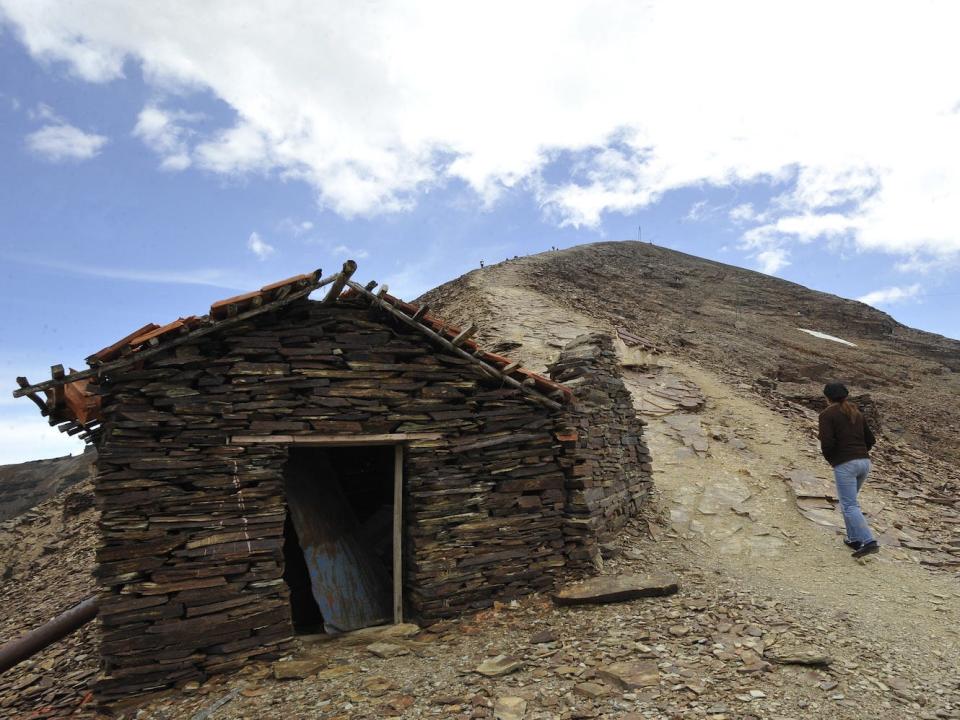 A tourist climbs up the Chacaltaya mountain.