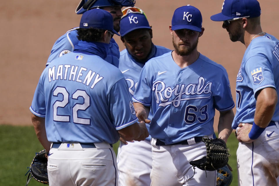 Kansas City Royals manager Mike Matheny (22) takes the ball from relief pitcher Josh Staumont (63) during the seventh inning of a baseball game against the Chicago White Sox at Kauffman Stadium in Kansas City, Mo., Sunday, Sept. 6, 2020.(AP Photo/Orlin Wagner)