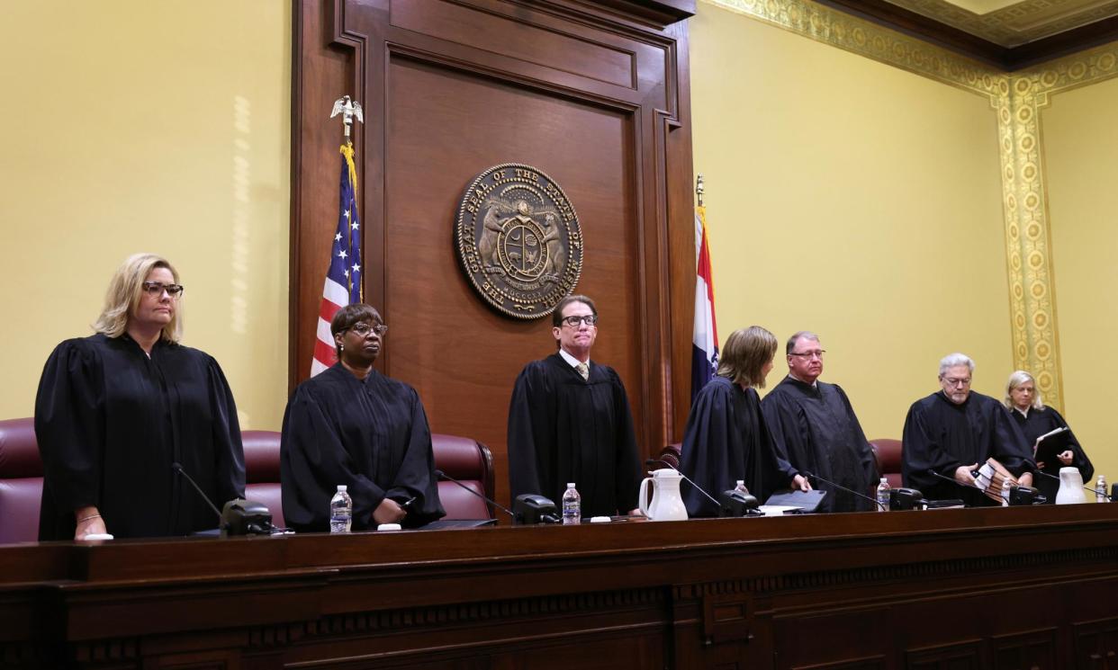 <span>Missouri supreme court justices take the bench to hear a case questioning whether an amendment to overturn the state's abortion ban will remain on the November ballot in Jefferson City on 10 September 2024.</span><span>Photograph: Robert Cohen/St Louis Post-Dispatch via AP</span>