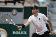Austria's Dominic Thiem plays a shot against Bolivia's Hugo Dellien during their first round match at the French Open tennis tournament in Roland Garros stadium in Paris, France, Sunday, May 22, 2022. (AP Photo/Thibault Camus)