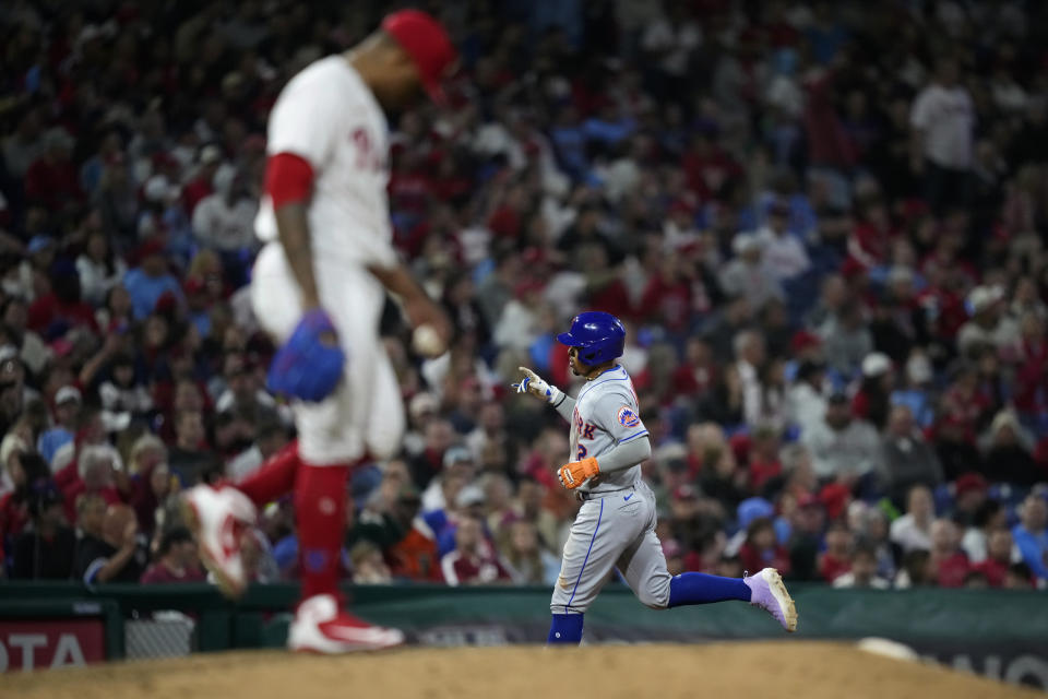 New York Mets' Francisco Lindor, right, rounds the bases after hitting a home run against Philadelphia Phillies pitcher Gregory Soto during the eighth inning of a baseball game, Friday, Sept. 22, 2023, in Philadelphia. (AP Photo/Matt Slocum)