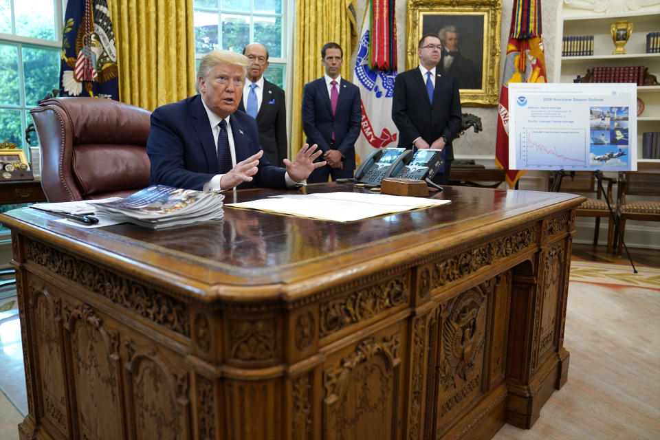 President Donald Trump speaks as he receives a briefing on the 2020 hurricane season in the Oval Office of the White House, Thursday, May 28, 2020, in Washington. Watching are Commerce Secretary Wilbur Ross and Neil Jacobs, assistant Secretary of Commerce for Environmental Observation and Prediction, and Pete Gaynor, administrator of the Federal Emergency Management Agency. (AP Photo/Evan Vucci)