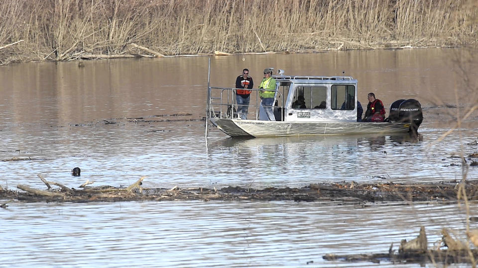 In this Wednesday, Dec. 4, 2019, photo, Missouri law enforcement personnel aided by the United States Geological Survey team use imaging sonar to try to locate the body of Mengqi Ji Elledge near Columbia, Mo. Divers searched for Elledge, in the Lamine River in Cooper County. Authorities say they have discovered human remains that they believe are the body of the Chinese woman who has been missing since October 2019. The remains were found Thursday, March 25, 2021 in Rock Bridge State Park in Boone County in mid Missouri. (Don Shrubshell/Columbia Daily Tribune via AP)