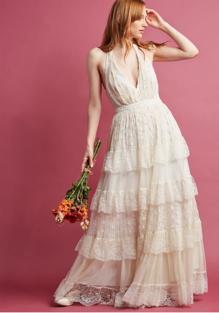 <p><i>Modcloth Layered Love Maxi Dress in Ivory, $250, <a rel="nofollow noopener" href="https://www.modcloth.com/shop/maxi-dresses/layered-love-maxi-dress-in-ivory/152040.html?dwvar_152040_color=IVRY&breadcrumb=bridal_dresses_53627" target="_blank" data-ylk="slk:modcloth.com;elm:context_link;itc:0;sec:content-canvas" class="link ">modcloth.com</a> </i></p>