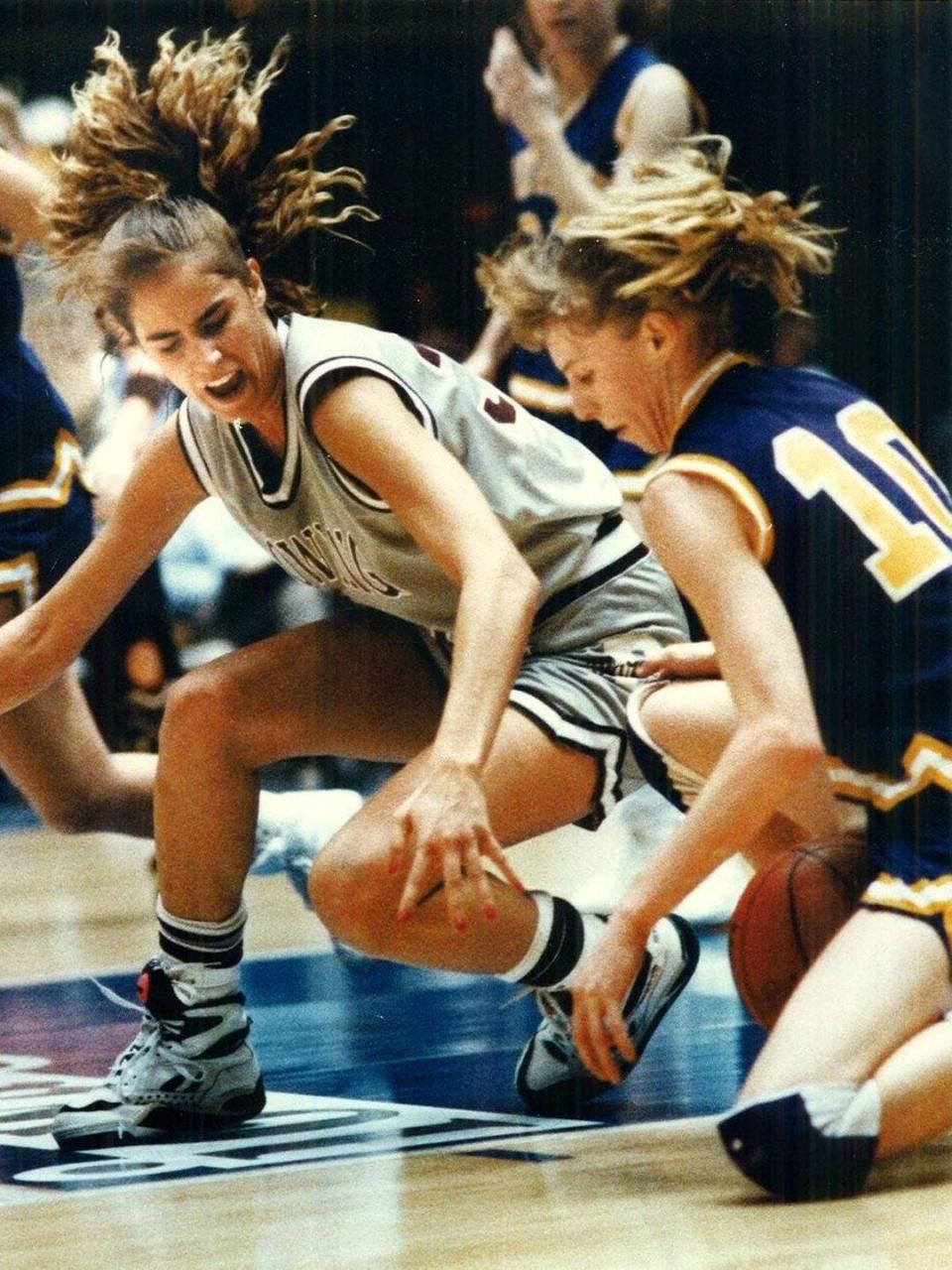 Dowling's Julie Nahas scrambles for a loose ball during the state tournament in 1992. Nahas, now Muller, is watching two of her daughters, Ellie and Katie, follow in her footsteps with the Maroons.