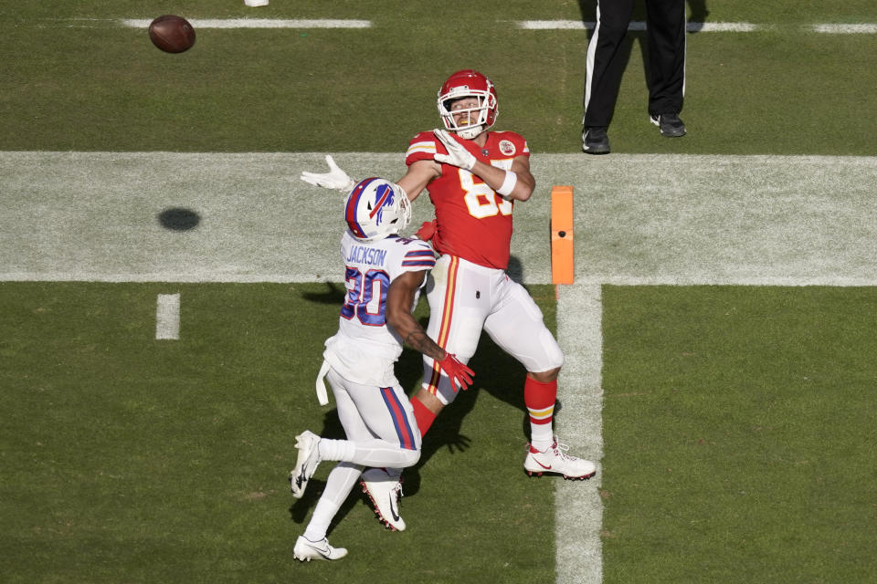 Kansas City Chiefs tight end Travis Kelce (87) is unable to catch a pass as Buffalo Bills cornerback Dane Jackson (30) defends during the first half of an NFL football game Sunday, Oct. 16, 2022, in Kansas City, Mo. (AP Photo/Charlie Riedel)