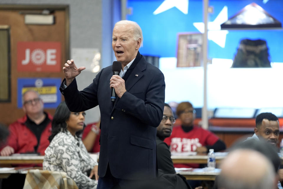 FILE - President Joe Biden meets with UAW members during a campaign stop at a phone bank in the UAW Region 1 Union Hall, Feb. 1, 2024, in Warren, Mich. (AP Photo/Evan Vucci, File)