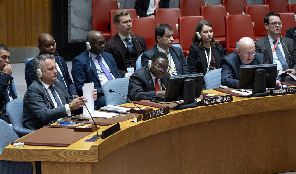 Ukrainian Ambassador to the United Nations Sergiy Kyslytsya, left, shuffles papers as he listens to Vassily Nebenzia, Permanent Representative of Russia to the United Nations, during a meeting of the U.N. Security Council as the war in Ukraine and recent attacks by Russia were discussed Monday, Oct. 9, 2023, at United Nations headquarters. (AP Photo/Craig Ruttle)