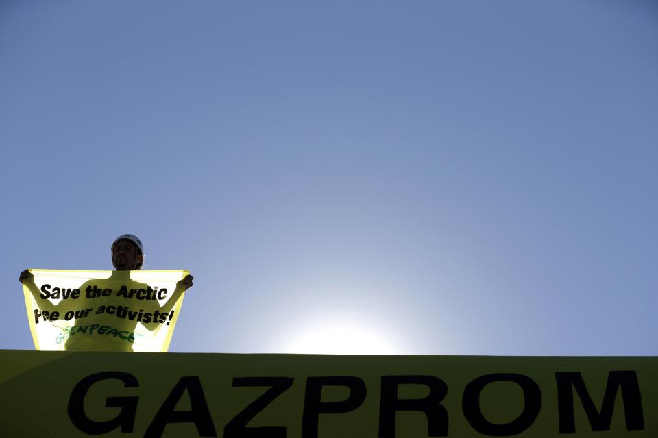 Greenpeace activist stands on top of the roof of a Gazprom gas station near the city of Blagoevgrad