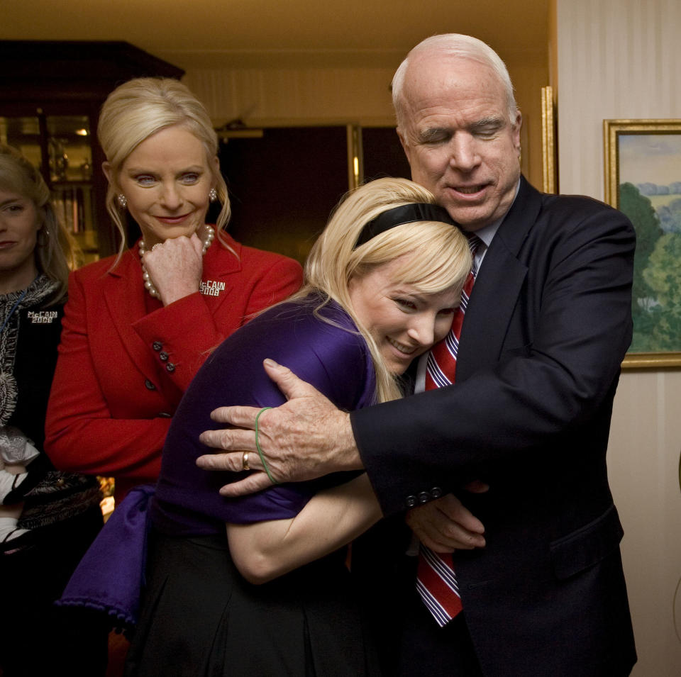 In his suite at the Crown Plaza Hotel, Republican Presidential contender Senator John McCain hugs his daughter Meghan McCain, with his wife Cindy McCain behind them, on Jan. 8, 2008 in Nashua, N.H.