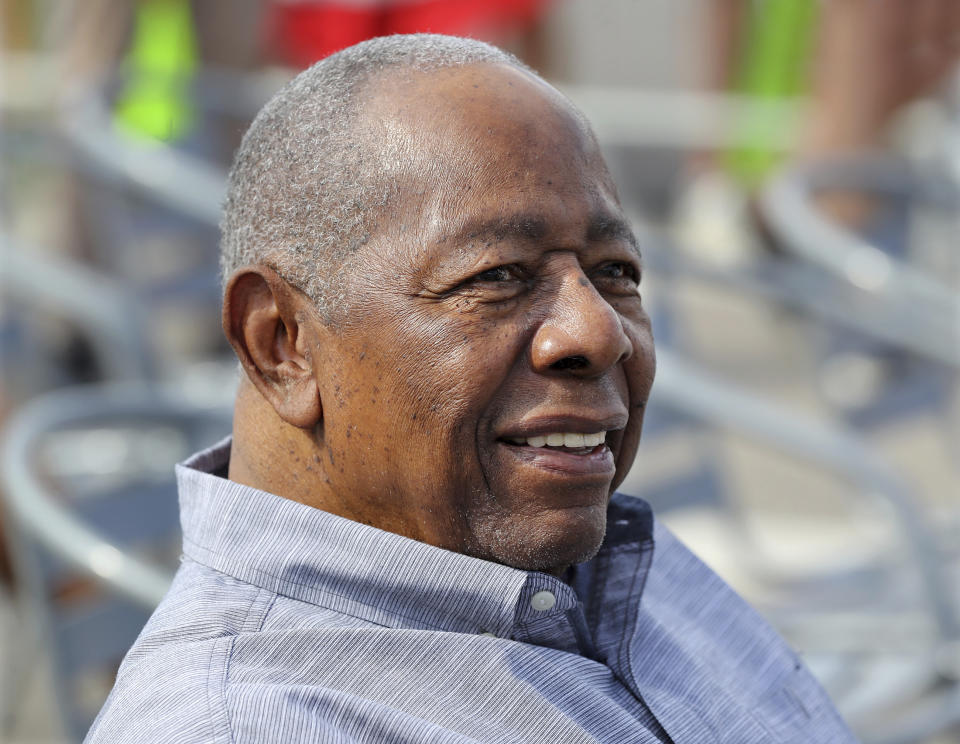 Baseball Hall of Famer Hank Aaron smiles as he is honored with a street named after him outside CoolToday Park, the spring training baseball facility of the Atlanta Braves, in North Port, Fla., Tuesday, Feb. 18, 2020 (Curtis Compton/Atlanta Journal-Constitution via AP)