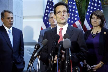 U.S. Majority Leader Eric Cantor (R-VA) (2nd R) is flanked by House Speaker John Boehner (R-OH) (L), Representative Kevin McCarthy (R-CA) (3rd R) and Representative Cathy McMorris Rodgers (R-WA) (R) as he speaks to reporters at the U.S. Capitol in Washington, October 15, 2013. REUTERS/Jonathan Ernst