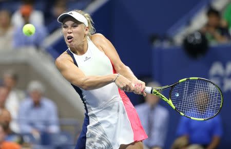 Sep 6, 2016; New York, NY, USA; Caroline Wozniacki of Denmark hits a shot to Anastasija Sevastova of Latvia on day nine of the 2016 U.S. Open tennis tournament at USTA Billie Jean King National Tennis Center. Jerry Lai-USA TODAY Sports