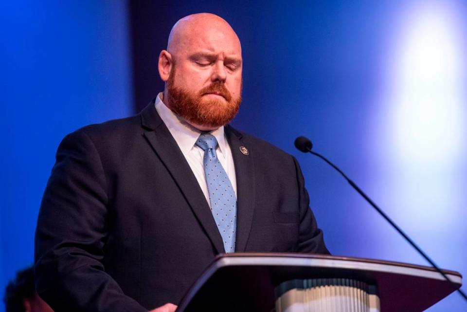 Assistant District Attorney Ian Baker reacts as he recounts speaking to a crime victim during a speech at a candlelight ceremony as a part of National Crime Victims’ Rights Week at First Baptist Church of Gulfport on Tuesday, April 23, 2024.