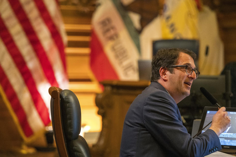 Supervisor Dean Preston addresses the public at the San Francisco Board of Supervisors meeting in San Francisco, Monday, Jan. 8, 2024. The city's board of supervisors is taking up a controversial resolution calling for a sustained cease-fire in Gaza, a resolution that pro-Palestinian and Jewish peace groups have successfully pushed through in other cities. (AP Photo/Nic Coury)