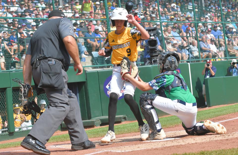 Nolensville Little League's Kale McCarty is tagged out by Northwest catcher Nathan Ehrlichman on a Corbin Cyphers single in the second inning of the Little League World Series in South Williamsport, Pennsylvania on Monday, August 21, 2023.