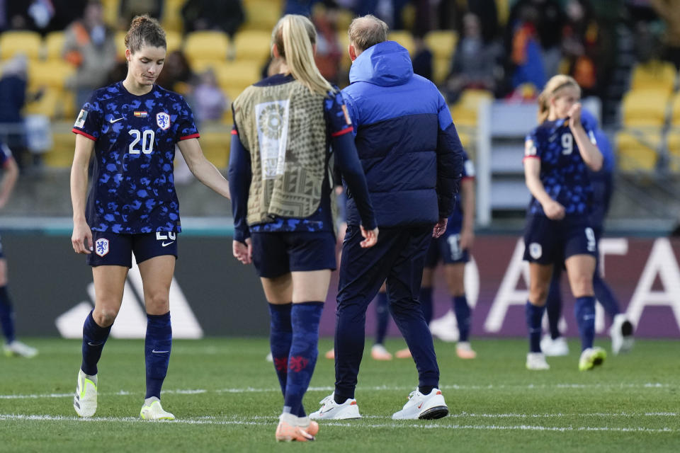 Netherlands' Dominique Janssen, left, reacts following their extra time loss in the Women's World Cup quarterfinal soccer match against Spain in Wellington, New Zealand, Friday, Aug. 11, 2023. (AP Photo/Alessandra Tarantino)