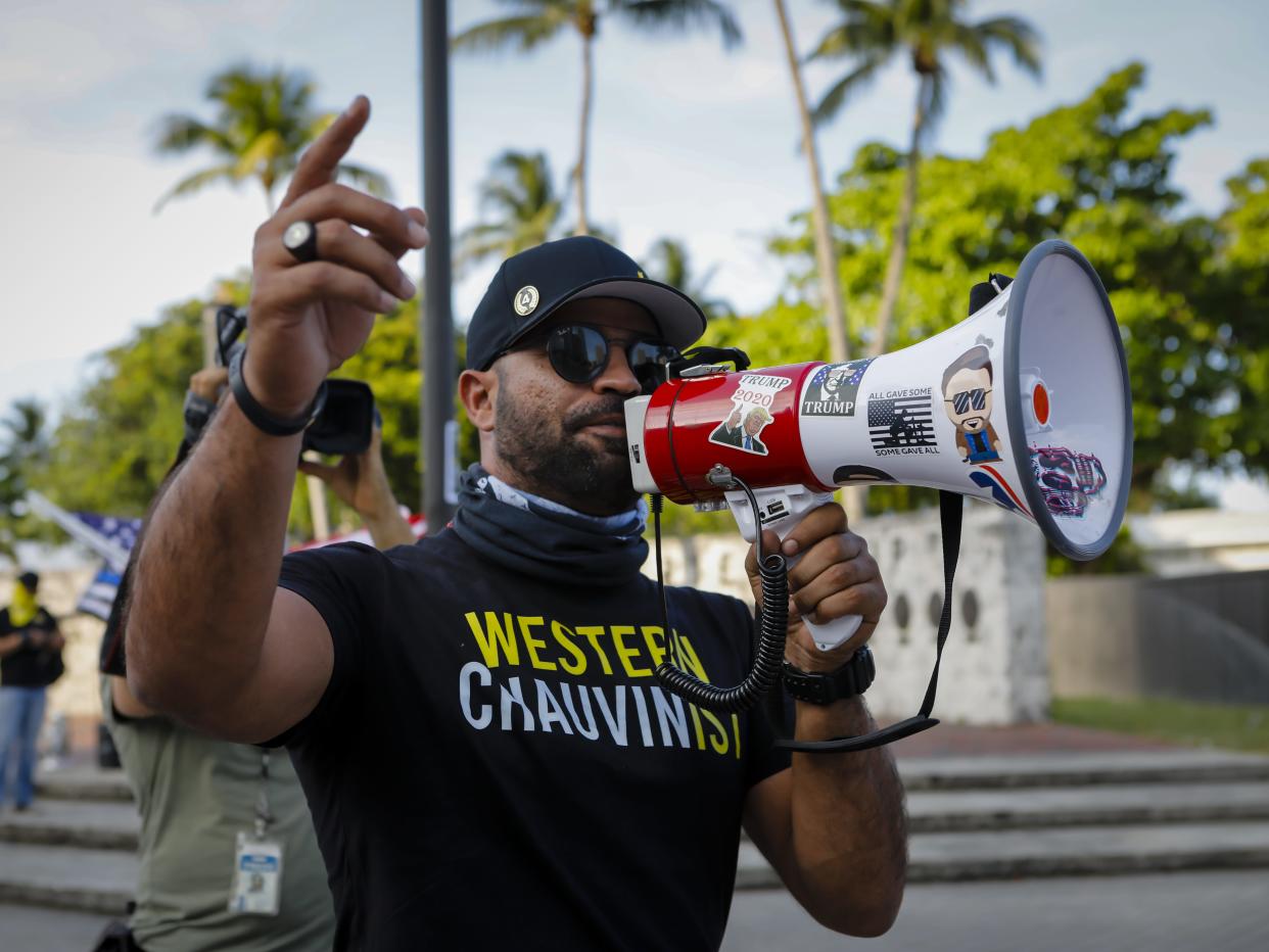 Enrique Tarrio, former leader of the Proud Boys, speaks to Black Lives Matters supporters during a commemoration of the death of George Floyd in Miami on May 25, 2021.