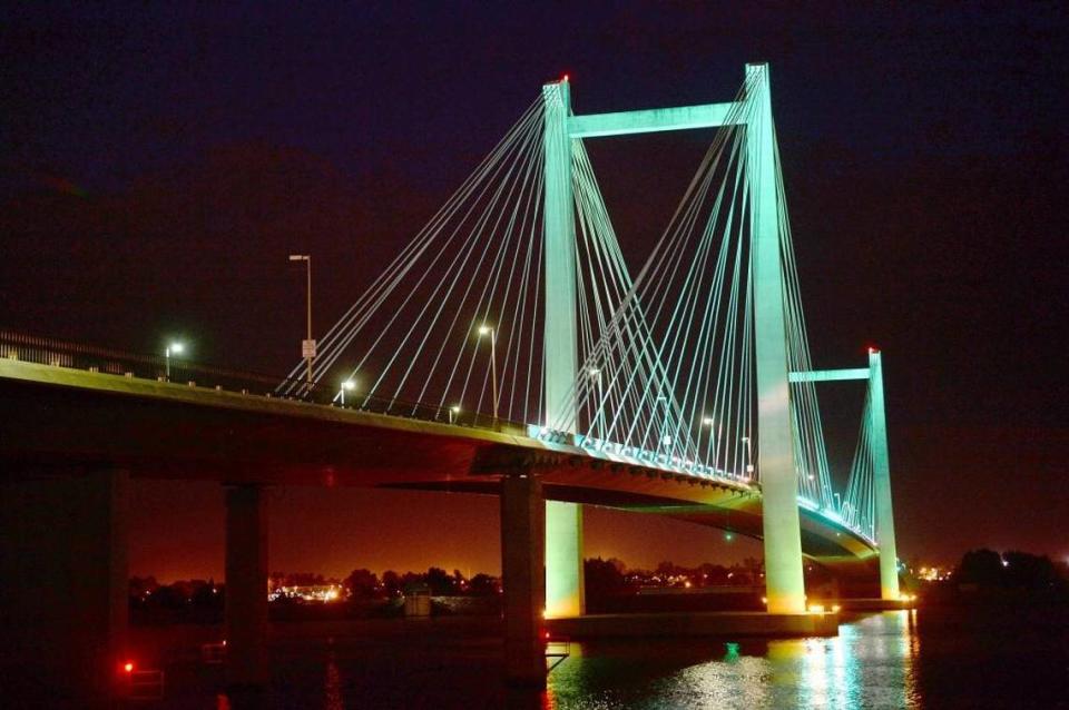 The cable bridge up in teal to raise awareness about ovarian cancer.