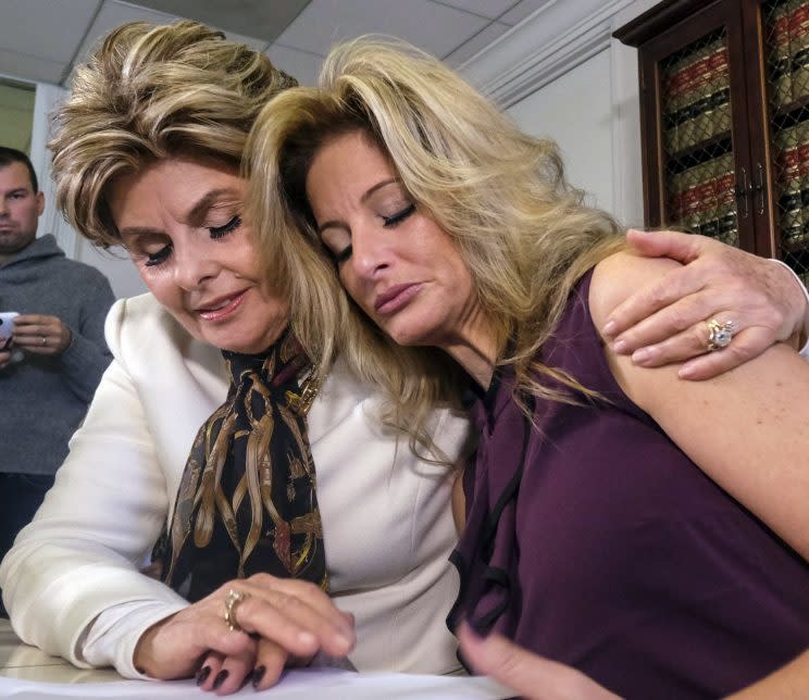 Attorney Gloria Allred, left, comforts Summer Zervos who accuses Donald Trump of victimizing her with inappropriate sexual conduct, during a news conference in Los Angeles on Friday Oct. 14, 2016. Summer Zervoshe latest woman to publicly accuse Trump of inappropriate behavior accusation. (Photo: Ringo H.W. Chiu/AP)