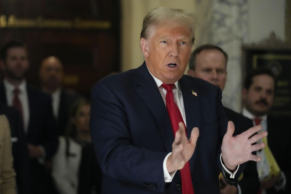 Former President Donald Trump speaks to reporters as he leaves the courtroom during a lunch break in his civil business fraud trial, Wednesday, Oct. 4, 2023, in New York. (AP Photo/Mary Altaffer)