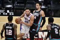 Philadelphia 76ers guard Ben Simmons (25) handles the ball as Memphis Grizzlies guard Dillon Brooks defends during the second half of an NBA basketball game Saturday, Jan. 16, 2021, in Memphis, Tenn. (AP Photo/Brandon Dill)