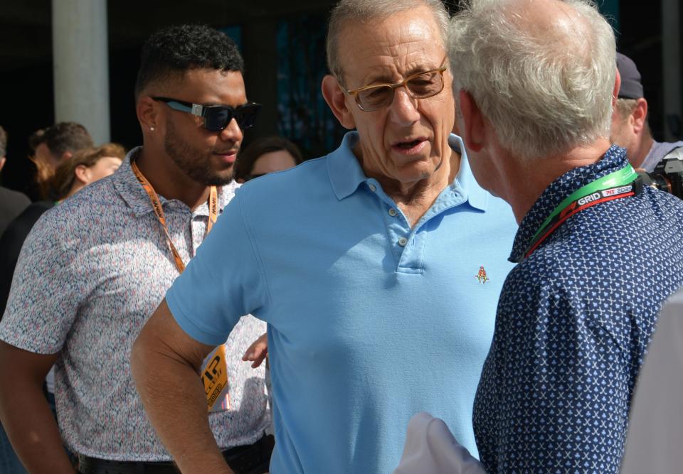 Dolphins owner Stephen M. Ross, center, and quarterback Tua Tagovailoa, left, took in the sights and sounds at the Miami Grand Prix on Friday.