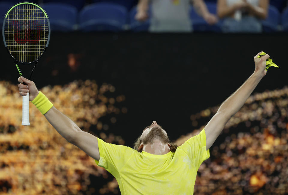 Greece's Stefanos Tsitsipas celebrates after defeating Australia's Thanais Kokkinakis in their second round match at the Australian Open tennis championship in Melbourne, Australia, Thursday, Feb. 11, 2021.(AP Photo/Rick Rycroft)