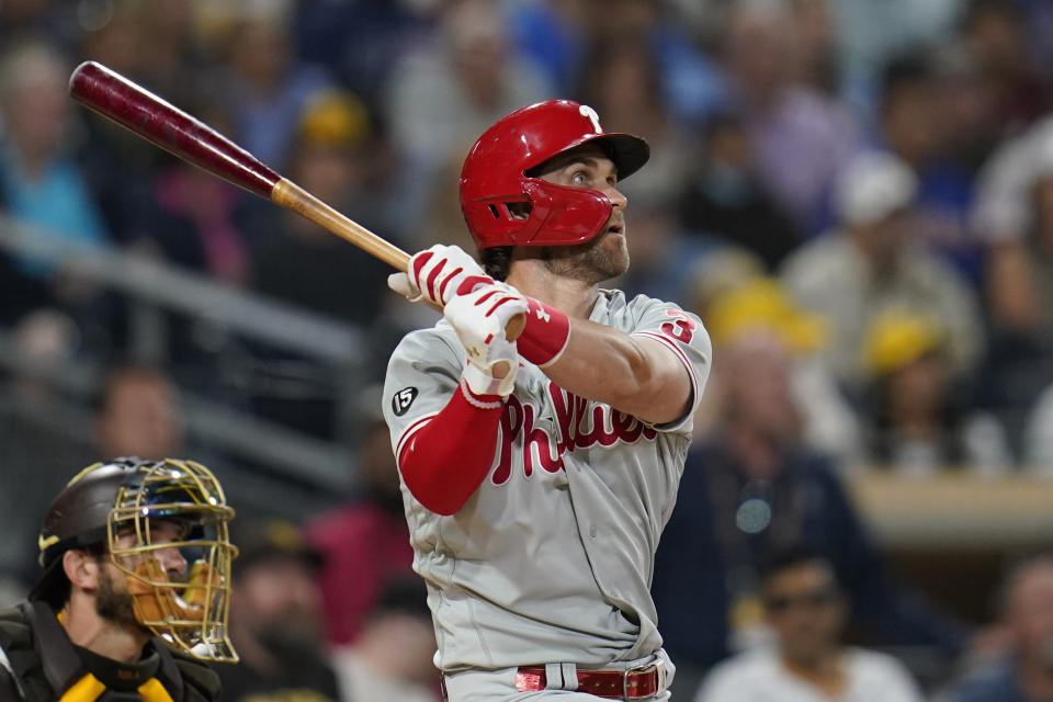 Philadelphia Phillies' Bryce Harper watches his two-run home run during the third inning of the team's baseball game against the San Diego Padres, Friday, Aug. 20, 2021, in San Diego. (AP Photo/Gregory Bull)