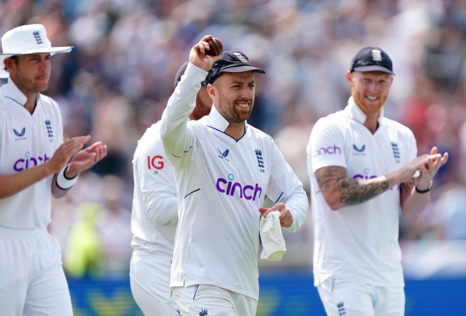 Jack Leach, centre, claimed five wickets for England (PA)