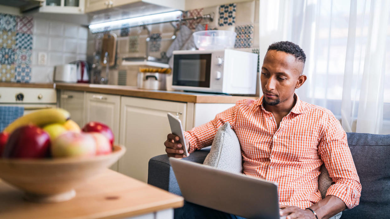 Young man working in his home office.