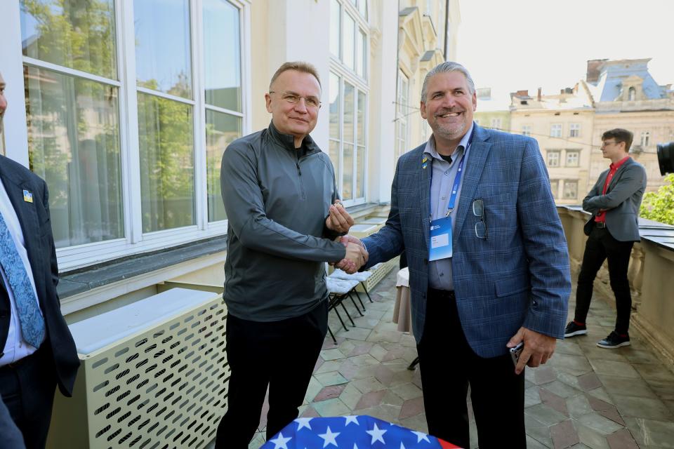 Lviv, Ukraine, Mayor Andriy Ivanovych Sadovyi poses for a photo while shaking hands with August Mission Chief Development Officer David Edgel at the mayors office in Lviv on Saturday, May 6, 2023. | Scott G Winterton, Deseret News